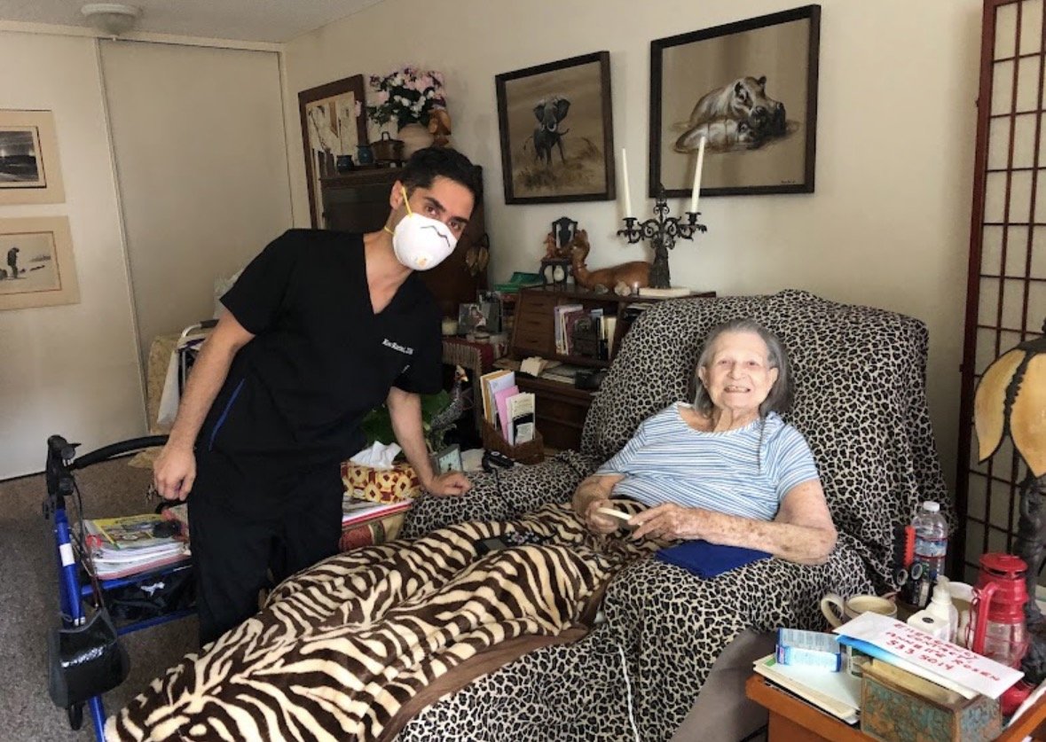 Dr. Koo treating a senior patient bedside